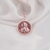 Graceful Rose Gold Plated Mary necklace featuring the Queen of Peace in prayer. A feminine and spiritual rose gold faith pendant.