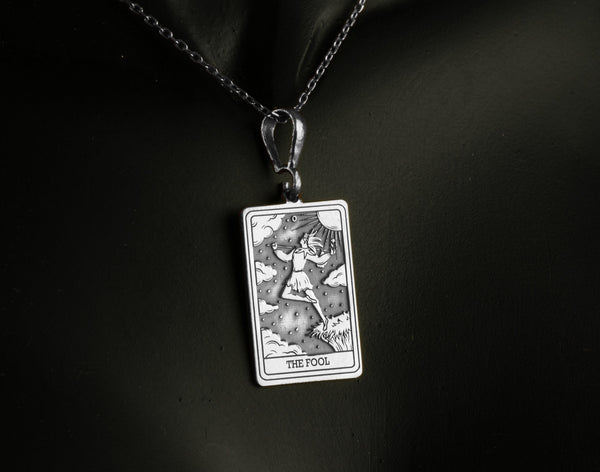 The Fool tarot card necklace silver necklace featuring , ideal for those seeking a protection necklace or friendship charm. This engraved charm is perfect for layering as a lightweight, minimalist necklace, adding elegance and mystery to any look.