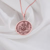 Shiva pendant necklace in rose gold vermeil, Lord Shiva, unisex, spiritual jewelry."This Shiva pendant necklace in rose gold vermeil is next-level. The round pendant’s got detailed engravings of Lord Shiva, and that rosy hue? Pure modern elegance. It’s unisex, spiritual, and perfect for anyone who wants to mix faith with a fresh, contemporary vibe.