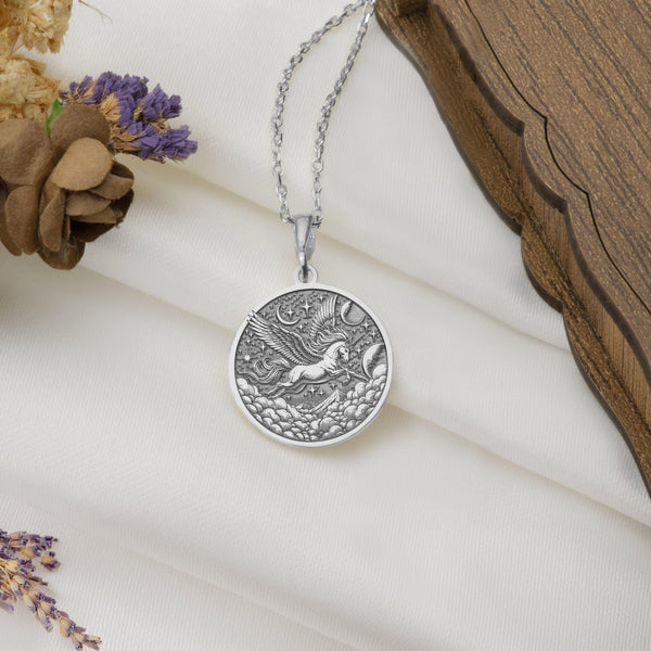 Silver Pegasus Charm Necklace, flying horse, Pegasus, also known as a horned flying horse. This silver necklace symbolizes freedom. Choose between a silver pendant or silver medallion, each custom-made to order for lovers of fantasy jewelry."