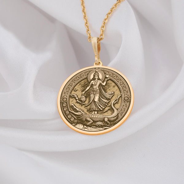 14K Solid Gold this Mother Ganga pendant necklace symbolizes the divine purity and healing energy of the Ganges River. The radiant gold enhances the pendant’s intricate design, embodying the sacred water goddess and the life force she represents. As a precious and durable material, 14K solid gold ensures that this powerful spiritual piece will be cherished for generations. The smooth, polished surface reflects the spiritual depth of the pendant, creating a luxurious yet meaningful talisma