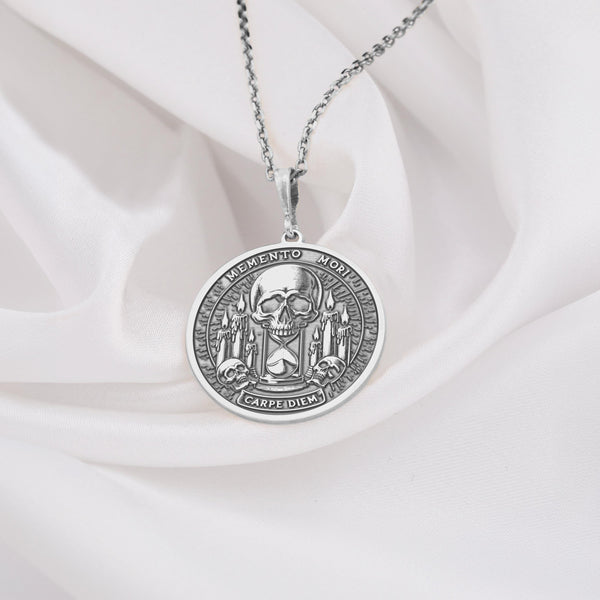 Memento Mori & Carpe Diem pendant, rendered in sleek, versatile Sterling Silver 925. The intricate design showcases a skull, hourglass, and candles, symbolizing the interplay of life, death, and time. This meaningful medallion serves as a potent Carpe Diem reminder. A coolly elegant piece of symbolic jewelry, ideal for daily wear or as a thoughtful gift. Ask about personalization options to create your unique piece.
