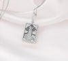 The Tower tarot card silver boho chic pendant necklace , depicted in a striking silver color features a tall, imposing structure being struck by highlighting the crumbling tower as it tilts precariously. Two figures are shown falling from the structure, symbolizing sudden upheaval or chaos. The background is often minimal, allowing the vivid silver tones to emphasize the tower's destruction and the sense of unexpected change or revelation it represents.