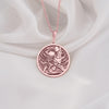 a necklace with a picture of a man on it