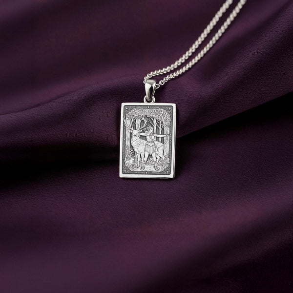 A handcrafted silver Artemis charm, personalized for a lover of Greek mythology. The design shows the protector of the wild with her animal companion.