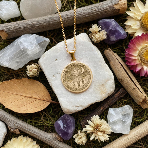 An heirloom-quality 14K solid gold round pendant engraved with a beautiful Portuguese Water Dog. This fine jewelry piece serves as a timeless and heartfelt pet memorial gift.