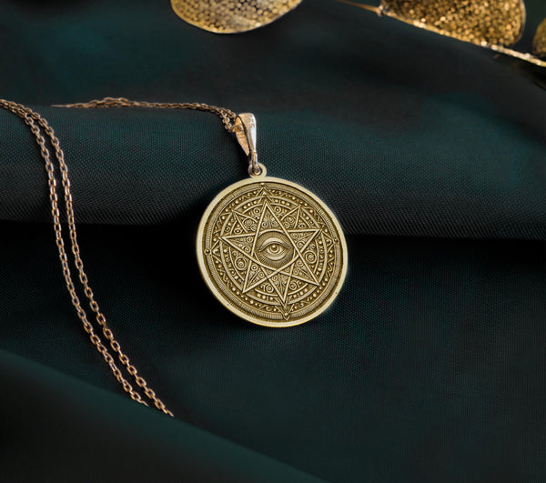 14k gold plated eye necklace with a star design, showcasing a detailed geometric pattern and protective eye symbol. This celestial inspired jewelry is ideal for men and women seeking stylish and symbolic accessories.