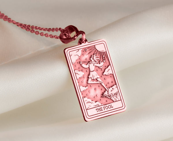 Rose gold pendant of The Fool tarot card, a boho style necklace for everyday wear. This statement charm adds mystical charm, making it an ideal friendship charm or good luck charm, perfect for layering in a unique, one-of-a-kind style
