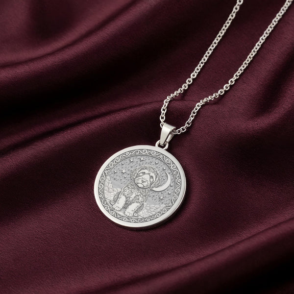 A striking 925 sterling silver celestial necklace showing a Portuguese Water Dog under the moon and stars. This unique piece of art is a beautiful symbol of a pet who has crossed the rainbow bridge.