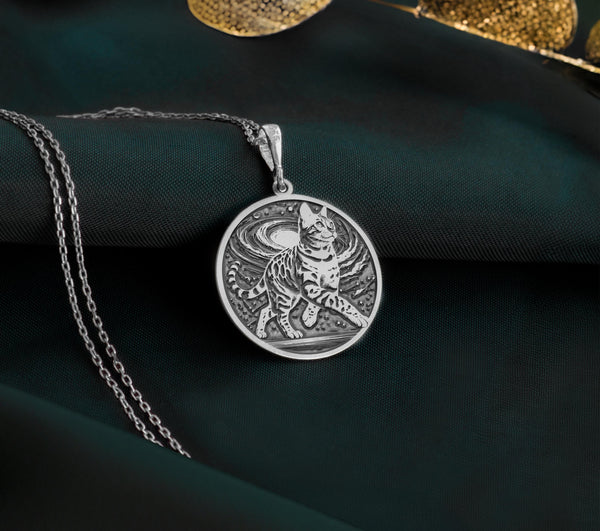 925 Sterling Silver Bengal Cat Pendant with detailed feline portrait. Handcrafted silver coin charm featuring exotic spotted domestic cat with wild heritage. Pet memorial necklace honoring these remarkable leopard-like companions.