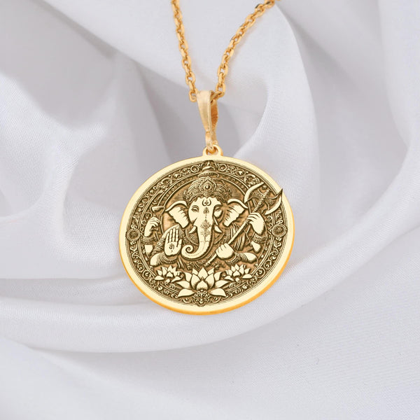 14k gold Ganesha pendant necklace, embodying the Hindu deity of wisdom and prosperity. This meticulously handcrafted charm radiates elegance, perfect for layering or as a meaningful statement piece symbolizing good fortune and blessings.