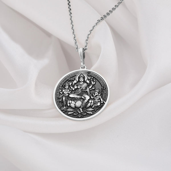 925 Sterling Silver Parvati and Sons Locket, featuring Parvati with Kartikeya and Ganesha, embodying divine motherhood, strength, and wisdom. This Hindu goddess locket is a sacred amulet for spiritual seekers, protection, and devotion to Shiva’s family.