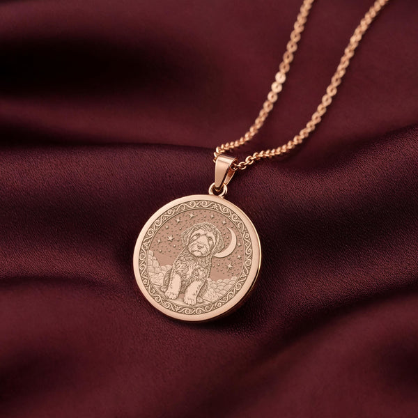 A unique rose gold plated round necklace with a custom engraved portrait of a Portuguese Water Dog (PWD). The detailed artwork is a perfect sympathy gift for a loss of pet.