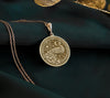 Radiant 14K Gold Plated peacock pendant, detailed with feathers and cosmic motifs. An artistic and nature-inspired gold necklace.