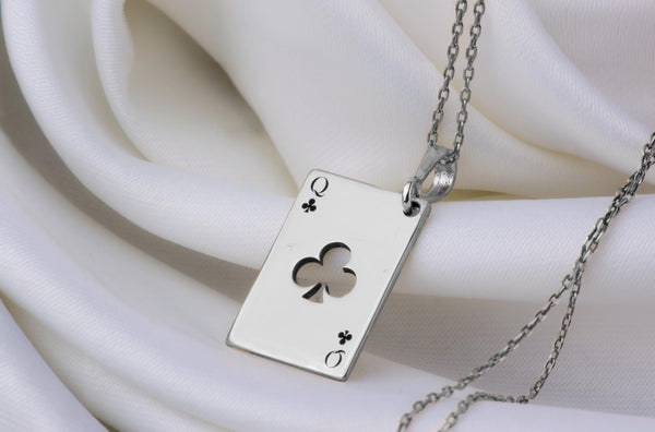 Queen of Club solitaire gold necklace playing card. club symbols and the iconic "Q" in the top left and bottom right corners. the Queen of Clubs, a symbol often linked to intuition, creativity, and power in the world of playing cards.