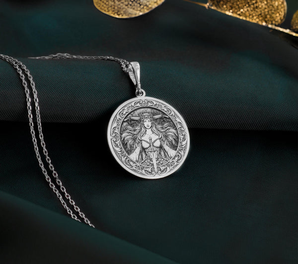 925 Sterling Silver Morrigan Pendant with detailed Celtic deity design. Handcrafted silver coin charm featuring warrior queen with crown, sword and flowing hair. Pagan jewelry celebrating the powerful battle goddess and sovereign feminine energy.
