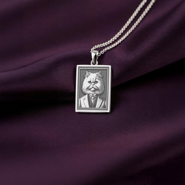 Front-facing view of the 925 Sterling Silver Persian Cat necklace, showcasing its bright, cool finish against the deep purple satin background.