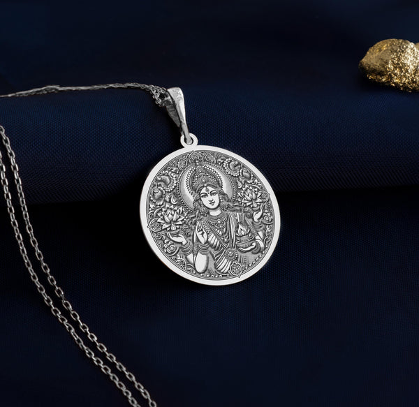 925 sterling silver Lakshmi pendant is a detailed charm representing the goddess of fortune. As a spiritual amulet or talisman, it brings prosperity and grace to the wearer. A stunning addition to any necklace or chain