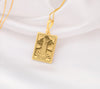 The Tower tarot cardboho chic pendant necklace , depicted in a striking gold color features a tall, imposing structure being struck by highlighting the crumbling tower as it tilts precariously. Two figures are shown falling from the structure, symbolizing sudden upheaval or chaos. The background is often minimal, allowing the vivid gold tones to emphasize the tower's destruction and the sense of unexpected change or revelation it represents.