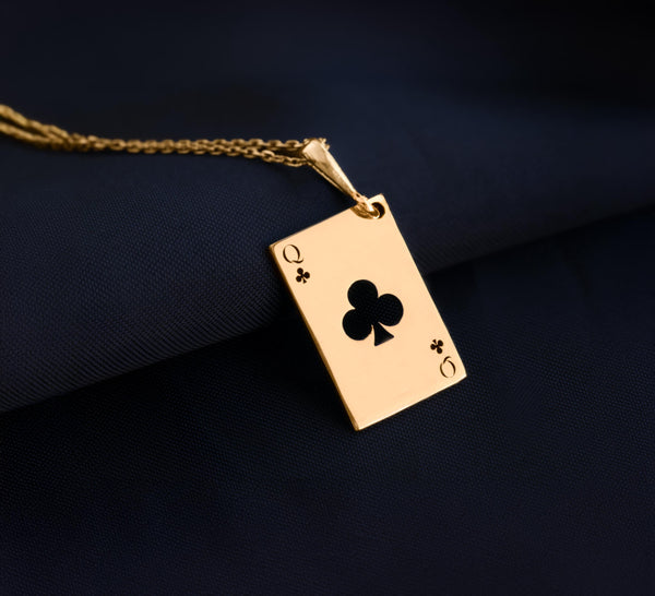 Queen of Club solitaire gold necklace playing card. club symbols and the iconic "Q" in the top left and bottom right corners. the Queen of Clubs, a symbol often linked to intuition, creativity, and power in the world of playing cards.