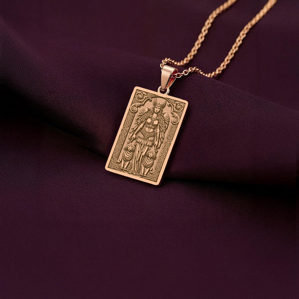 A unique rose gold plated rectangular necklace with a custom engraved portrait of the Viking goddess Freyja. The detailed artwork depicts her cat chariot, making this a powerful and beautiful piece of Scandinavian myth jewelry.