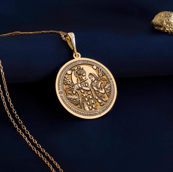Gold Krishna Radha pendant necklace symbolizes eternal love and spirituality. Krishna playing the flute for Radha captures romance and devotion. This elegant medallion is a timeless addition to any fine jewelry collection