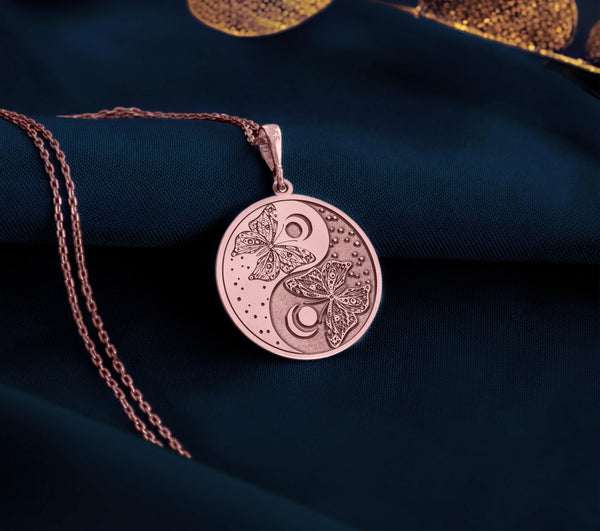 Rose Gold Plated Butterfly Yin Yang Pendant with spiritual balance design. Warm-toned transformation medallion with intricate insect details and celestial elements. Harmony jewelry celebrating personal evolution and balanced perspective.