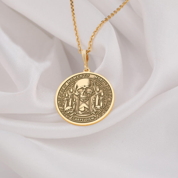 Memento Mori & Carpe Diem necklace, exquisitely crafted in radiant 14K Gold Plated, This detailed medallion features a central skull atop an hourglass, flanked by candles – a powerful reminder to live fully. A timeless piece of philosophical jewelry, perfect as a meaningful gift or personal talisman. Personalize it to make it uniquely yours. Carry this intricate symbol of stoic wisdom and seize the day.