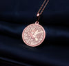 a pink necklace with a bird on it