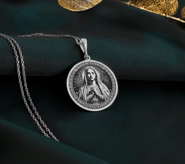 925 Sterling silver Queen of Peace Virgin Mary medallion, featuring radiant halo details. A peaceful and timeless Catholic faith charm.