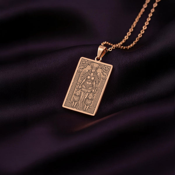 An elegant rose gold plated tarot card pendant celebrating the Norse goddess of love and war, Freya. This engraved amulet is a perfect Heathenry gift, representing the power and magic of the Seidr witch.