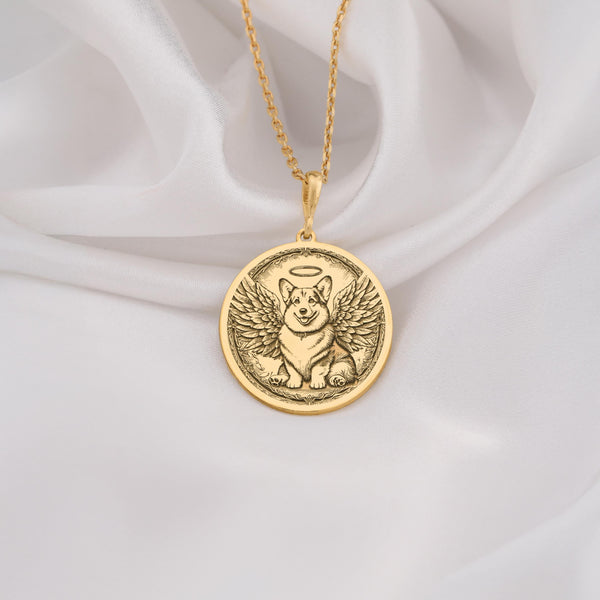 14K Solid Gold Pembroke Welsh Corgi Angel Dog Medallion featuring beloved royal breed with heavenly wings and halo. Detailed memorial talisman with short legs, fox-like face and ornate botanical border. Luxury Corgi memorial jewelry gift