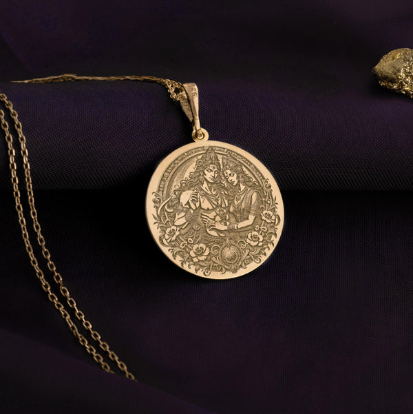 Gold-plated Shiva and Parvati pendant necklace with engraved celestial designs, layered over sterling silver for durability and shine.