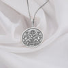 silver Surya necklace featuring a detailed pendant of the Hindu sun god, Surya, with intricate solar rays design. Crafted in sterling silver, this mythological-inspired jewelry piece symbolizes light, energy, and divine protection. Perfect for those seeking Hindu cultural jewelry or a unique sun-themed accessory. The pendant showcases Surya riding his chariot, pulled by seven horses, with lotus flowers in hand, embodying warmth and enlightenment.