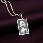 925 Sterling Silver version of The Ancestors Collection's Persian Cat necklace, with its cool silver tone beautifully contrasting the rich purple fabric.