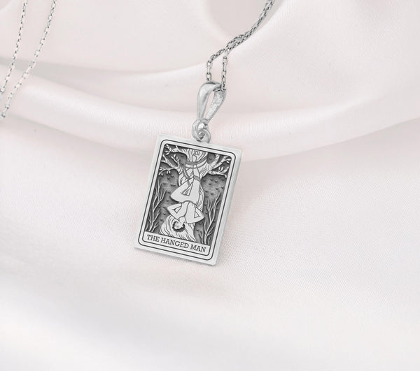 Hanged Man Tarot Necklace Silver, Tarot Jewelry Silver, Spiritual Jewelry Silver, Mystical Jewelry Silver, Occult Jewelry Silver, Silver Tarot Necklace, Hanged Man Pendant Silver, Silver Hanged Man Pendant, Silver Tarot Necklace for Women, Silver Tarot Necklace for Men, Silver Tarot Necklace Gift, Sterling Silver Tarot Necklace, Handmade Tarot Necklace Silver, Unique Tarot Necklace Silver, Silver Jewelry for Transformation, Silver Jewelry for Self-Discovery, Silver Jewelry for Inner Peace
