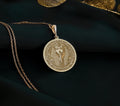 14k solid yellow gold Tutankhamun coin pendant, real gold charm representing Egyptian royalty. Lightweight and versatile, ideal for layering or solo wear. This unique amulet is a meaningful gift, blending mystique and minimalist elegance.