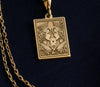 Gold Ace of Queens pendant featuring two intricately detailed queens holding a heart card, symbolizing sapphic love, LGBTQ+ pride, and empowerment.