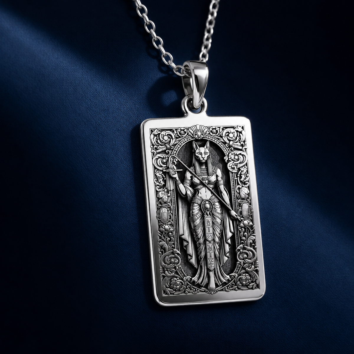Studio front view of 925 Sterling Silver Bastet Egyptian Cat Goddess Rectangle Pendant Necklace, featuring Ancient Egyptian Mythology Divine Feline Protection Talisman with crisp engraved relief details.