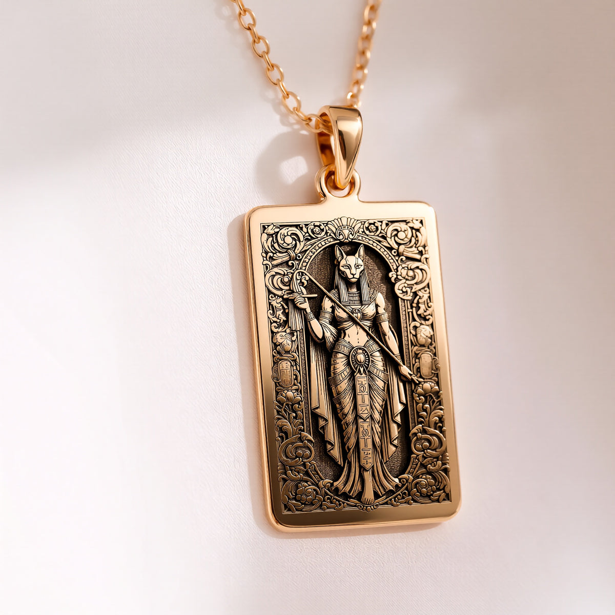 Studio front view of 14K Gold Plated Bastet Egyptian Cat Goddess Rectangle Pendant Necklace, featuring Ancient Egyptian Mythology Divine Feline Protection Talisman with crisp engraved relief details.