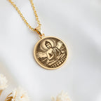 14K solid gold Buddha Medallion Necklace: round  Buddha in dhyana mudra seated on lotus...