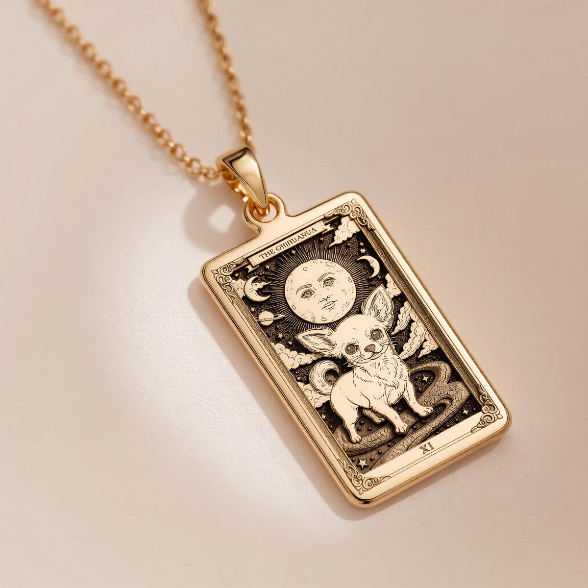 An heirloom-quality 14K solid gold Chihuahua tarot pendant. The art shows the tiny dog in a "Sun" card, symbolizing a big personality, a precious dog mom gift.