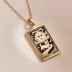 An heirloom-quality 14K solid gold Corgi tarot pendant. The art shows the whimsical dog under a moon, symbolizing a playful spirit, a precious dog mom gift.