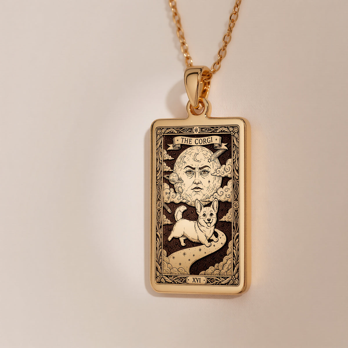 A handmade 14K gold plated Corgi necklace. The engraving captures the celestial dog in a whimsical tarot card style.