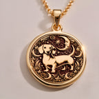 Elegant 14K Gold Plated dachshund pendant engraved with floral motifs and a celestial sky. Ideal for dog moms and animal charm collectors.