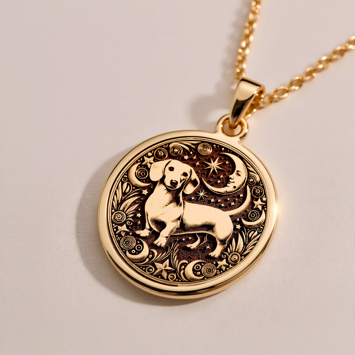 Elegant 14K Gold Plated dachshund pendant engraved with floral motifs and a celestial sky. Ideal for dog moms and animal charm collectors.