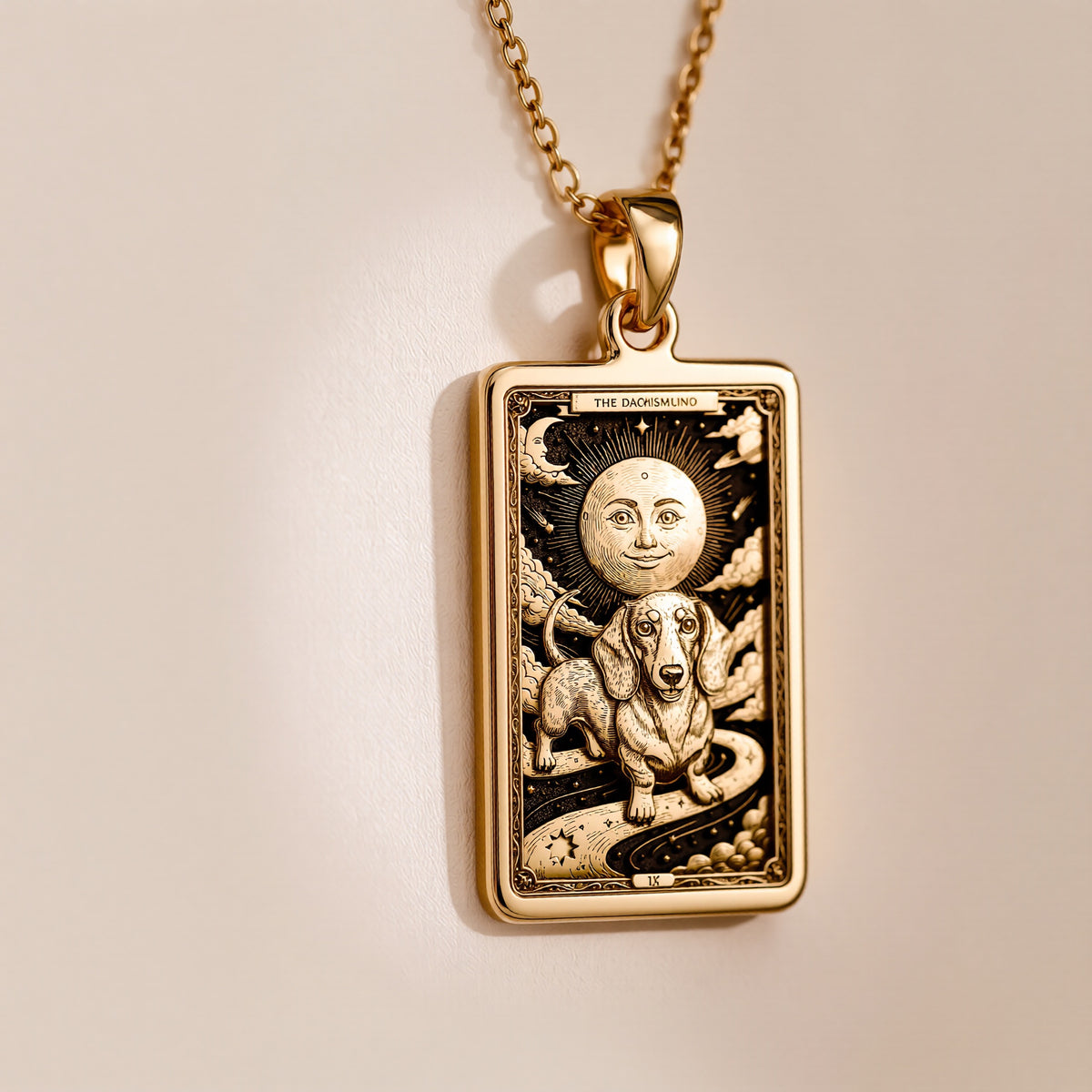 An heirloom-quality 14K solid gold Dachshund tarot pendant. The art shows the dog in a "Sun" card, symbolizing a sunny personality, a precious dog mom gift.