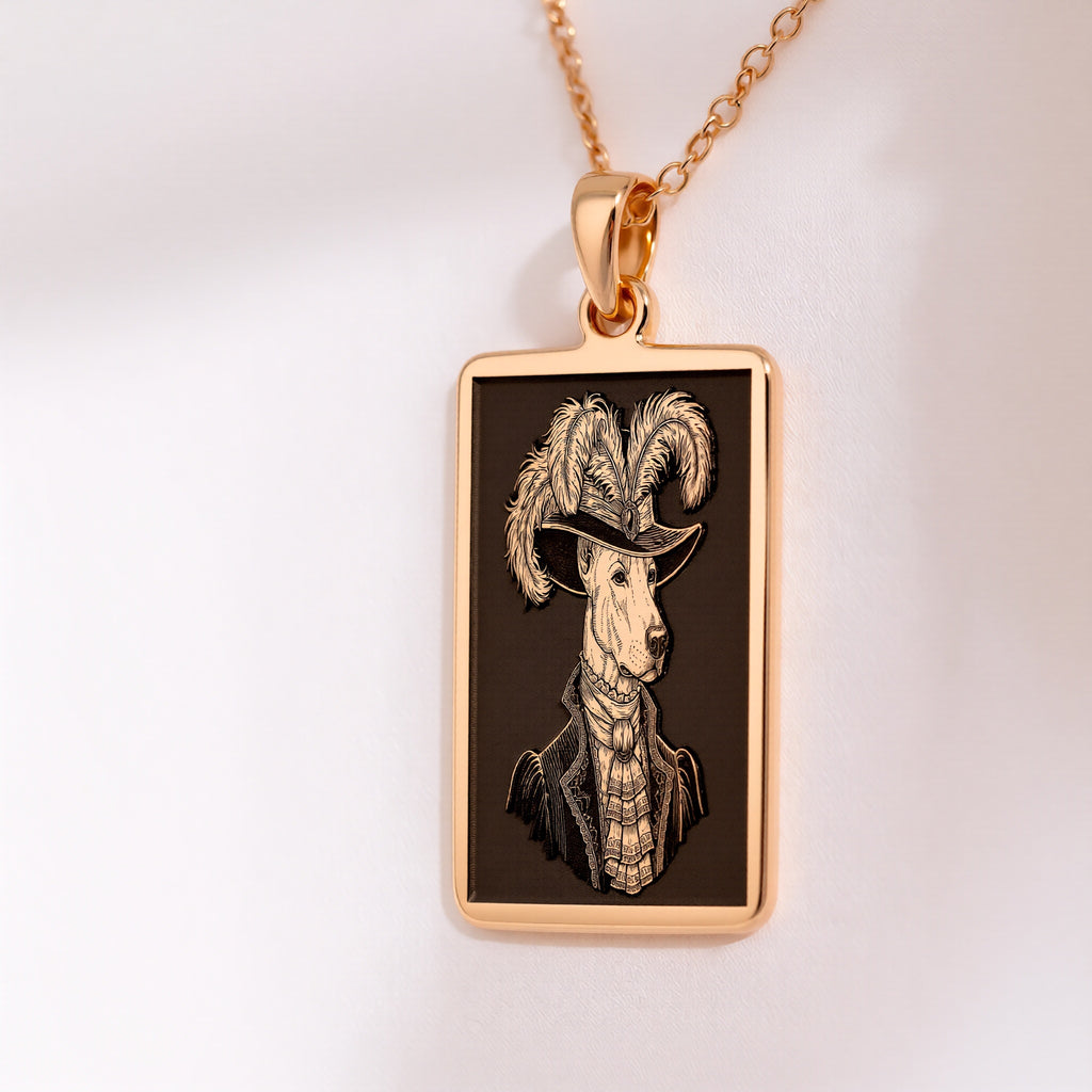 A slightly angled view of the 14K Solid Gold Doberman pendant. This perspective highlights the polished gleam on the pendant's frame and the depth of the engraving.