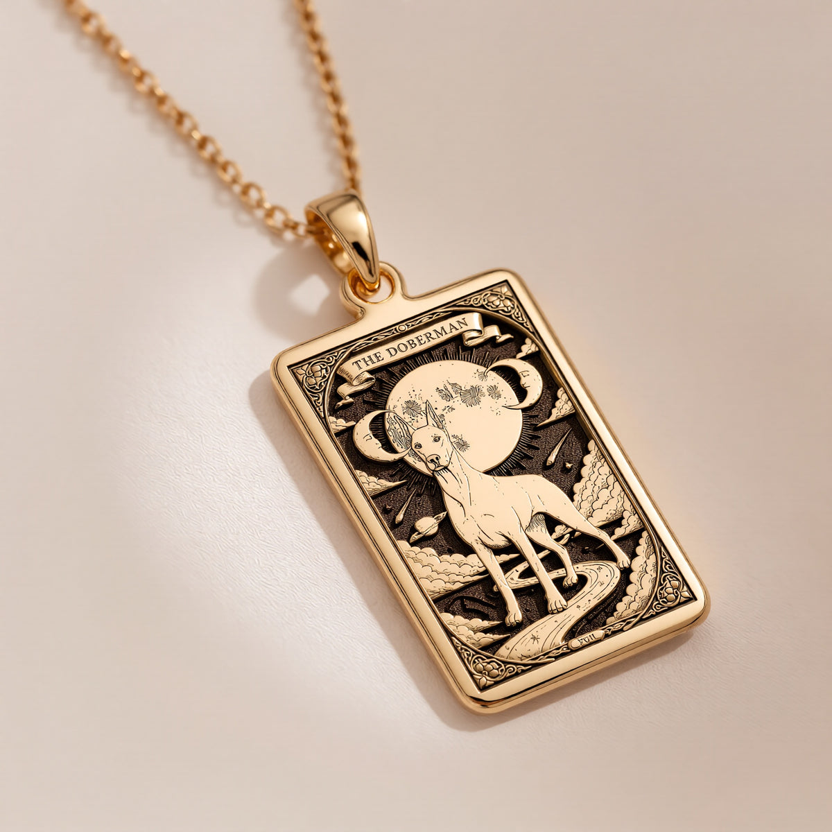 An heirloom-quality 14K solid gold Doberman tarot pendant. The art shows the elegant dog under the moon, symbolizing a loyal guardian, a precious dog mom gift.