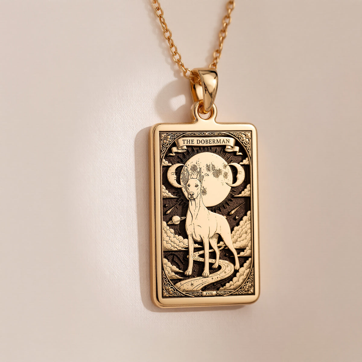 An heirloom-quality 14K solid gold Doberman tarot pendant. The art shows the elegant dog under the moon, symbolizing a loyal guardian, a precious dog mom gift.